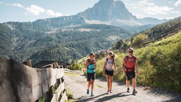 Two women and a man on a hike