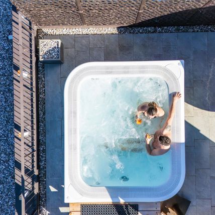 A couple in the outdoor whirlpool