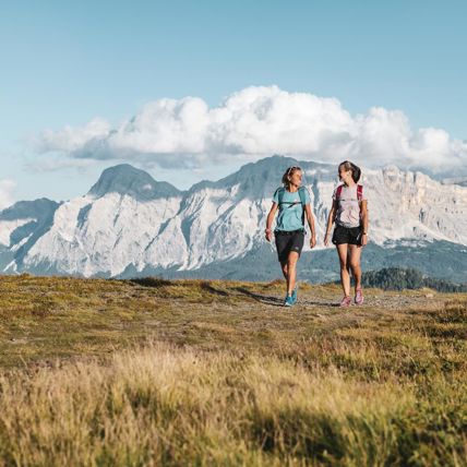 Two women are hiking in the mountains