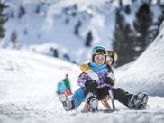 Two kids on a toboggan
