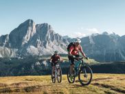 Two mountain bikers on a tour in the Dolomites